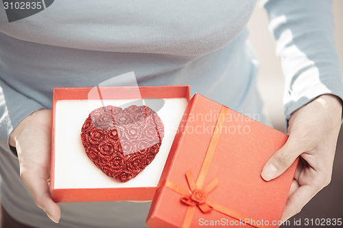 Image of Woman with romantic cake