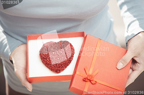 Image of Woman with romantic cake