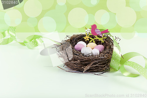 Image of Easter nest with green background