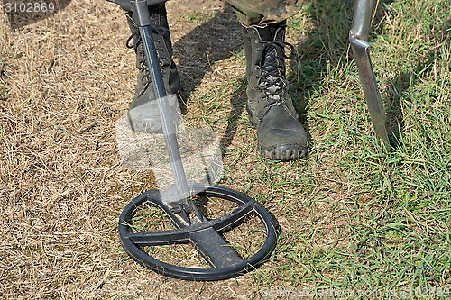 Image of Search for treasure with metal detectors.