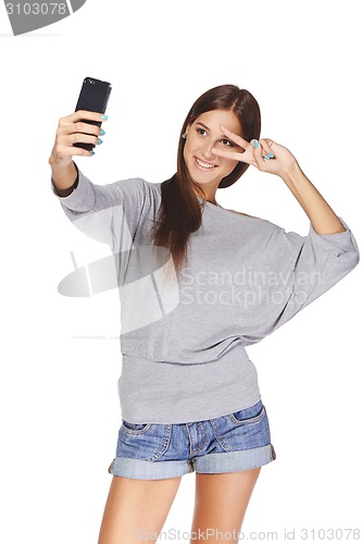 Image of Female taking pictures of herself at smart phone