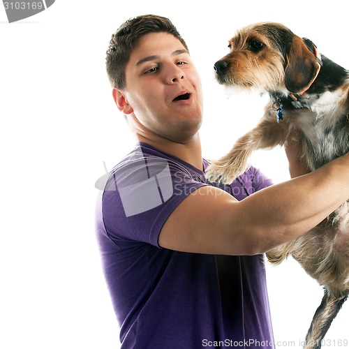 Image of Man Holding His Pet Dog