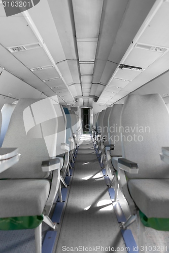 Image of Interior of an airplane with many seats