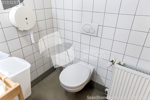 Image of Opened door with toilet