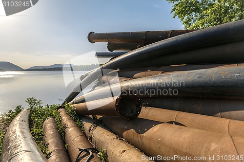 Image of Rusty metal pipes in the forest