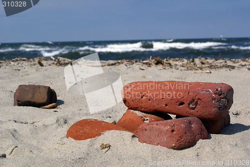 Image of Red bricks on the beach