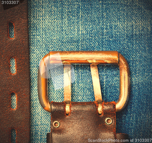 Image of Aged leather belt with a buckle