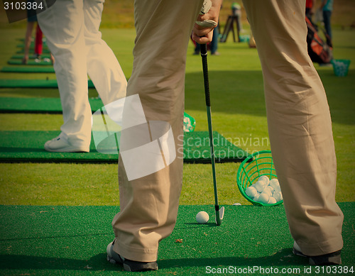 Image of golfer ready to tee off