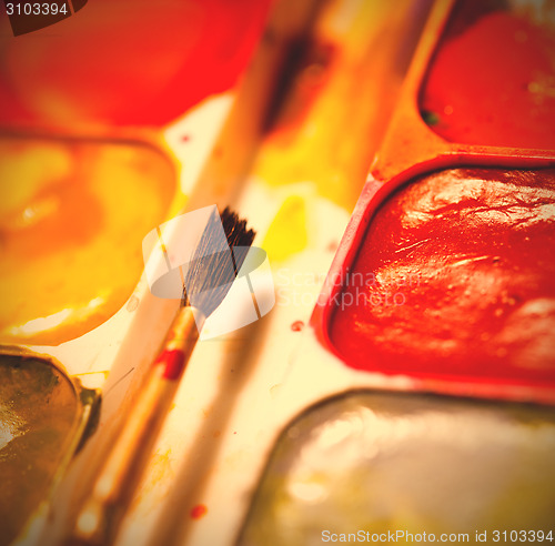 Image of still life with aquarelle and brush