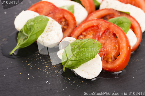 Image of Caprese salad with mozzarella, tomato, basil and balsamic vinega