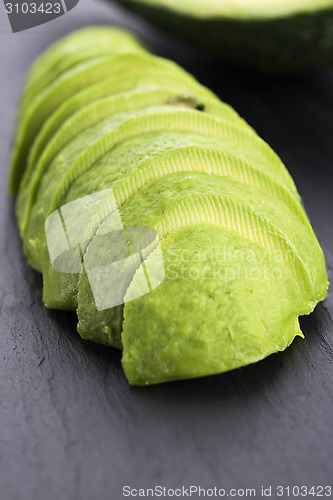 Image of ripe cleaned peeled avocado sliced