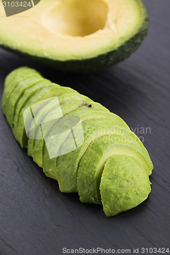 Image of ripe cleaned peeled avocado sliced