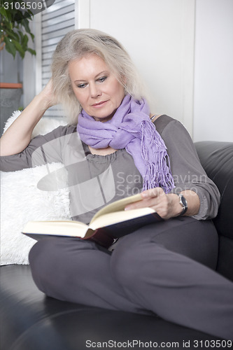 Image of woman reading book