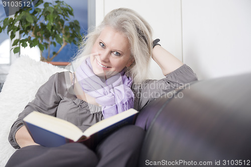 Image of woman reading book