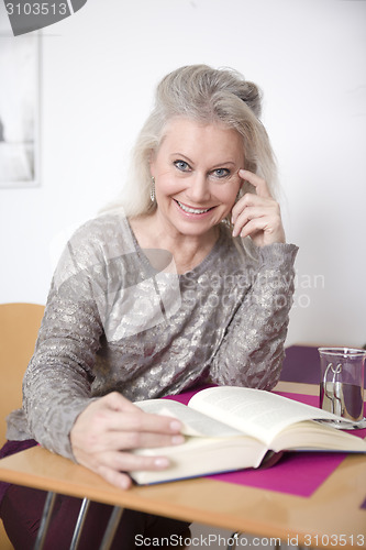 Image of woman reading book