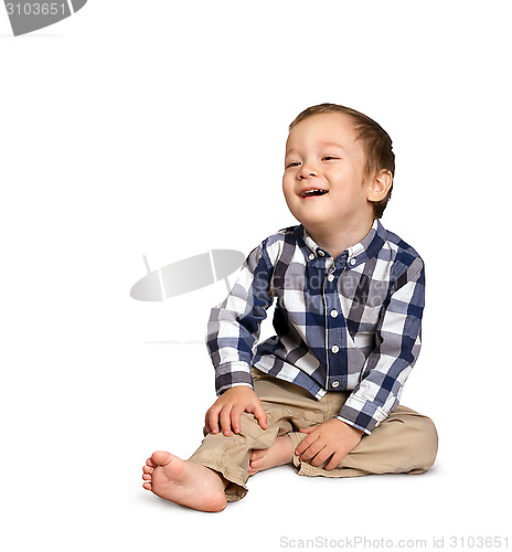 Image of Cute boy siting on the floor