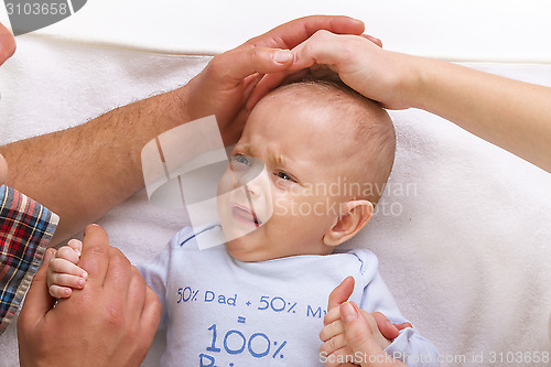 Image of parents calm a crying baby