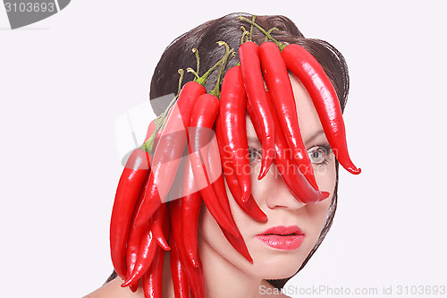 Image of Pretty Face Covered with Hot Chili Pepper