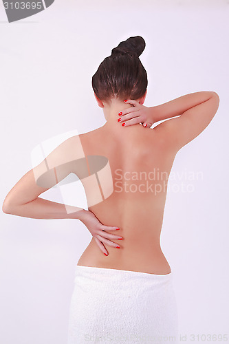 Image of Woman with aching back and neck