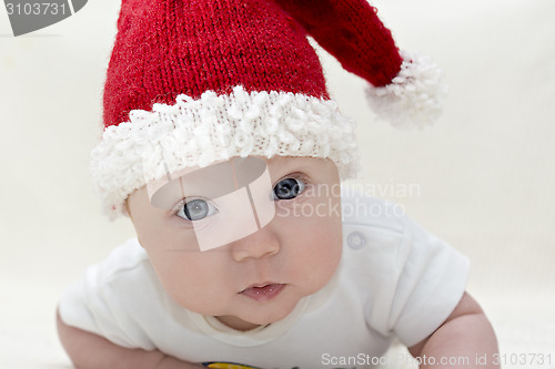 Image of Small boy in knitted red hat