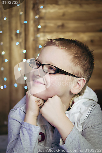 Image of Teen boy in black glasses 