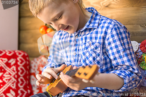 Image of Teen boy with guitar 