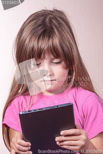 Image of The child with the computer