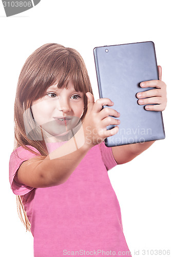 Image of The child with the tablet