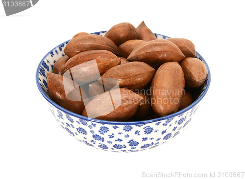 Image of Pecan nuts in a blue and white china bowl