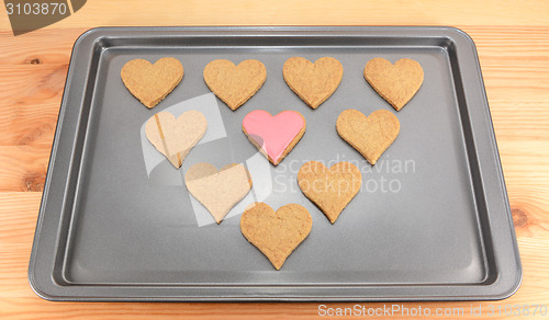 Image of Heart-shaped biscuits on a cookie sheet