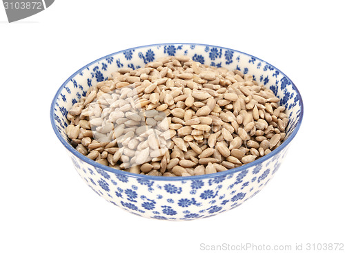 Image of Sunflower seed hearts in a blue and white china bowl