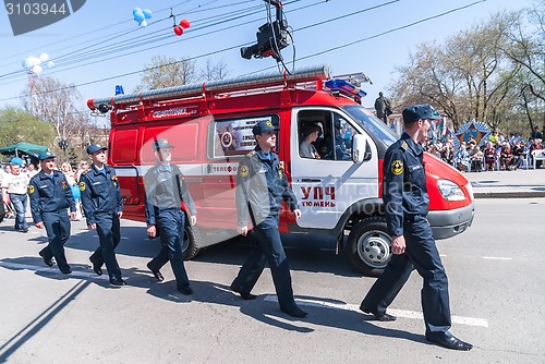 Image of Employees and car of fire department on parade