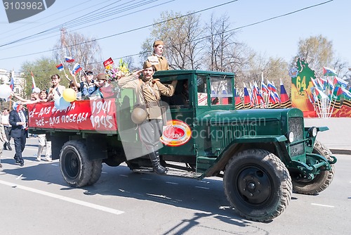Image of ZIS-5 truck with soldier and children on parade