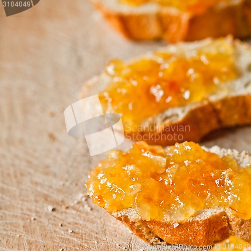 Image of pieces of baguette with orange marmalade