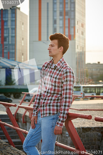 Image of Handsome man outdoors over urban background