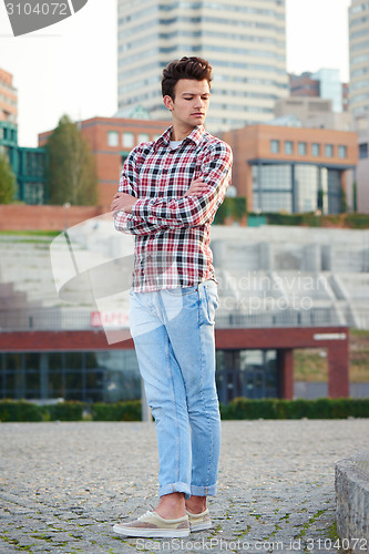 Image of Handsome man outdoors over urban background