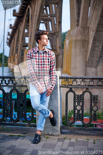 Image of Handsome man outdoors over urban background