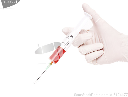 Image of Hands of the doctors filling a syringe 
