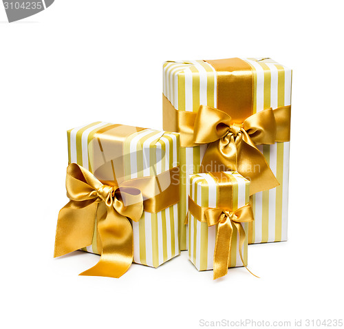 Image of Gold gift boxes isolated on white background