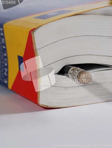 Image of book with pencil