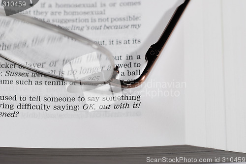 Image of glasses on book