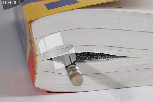 Image of pencil and dictionary