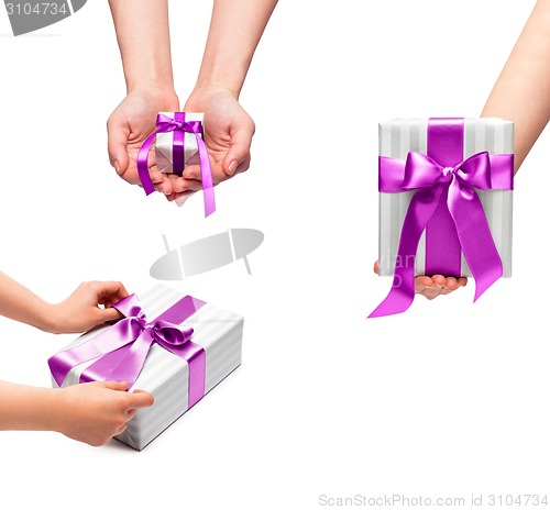 Image of male holding gift boxes with a bow