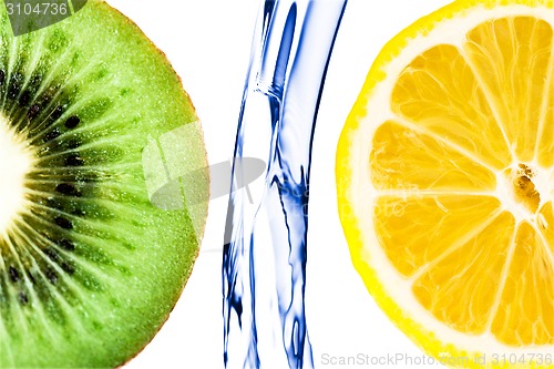 Image of sliced lime with lemon splashing in water isolated
