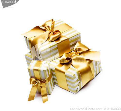 Image of Gold gift boxes isolated on white background