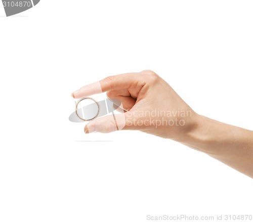 Image of Man holding a golden ring