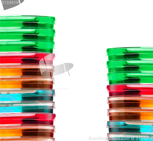 Image of Stack of colorful Petri dishes isolated