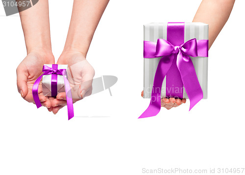 Image of christmas gift with decorative pink ribbon bow