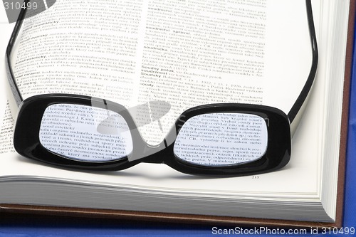 Image of Glasses on a book