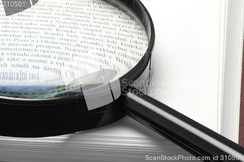 Image of Hand-glass on a book